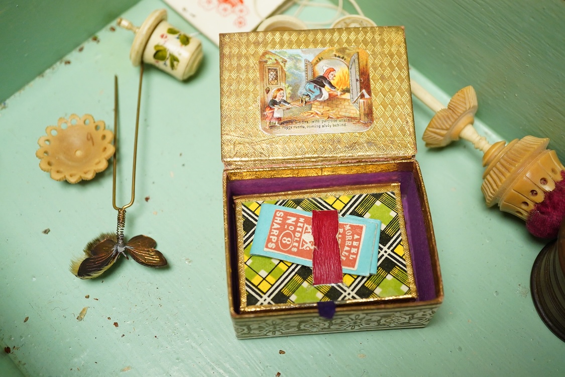 A Victorian mother of pearl inlaid rosewood sewing box and contents including a silver thimble and carved bone thread reels, 33cm wide
